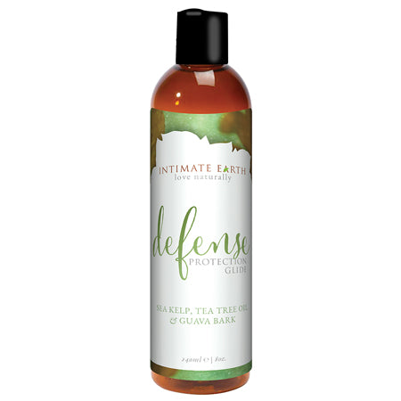 A bottle of Intimate Earth Defense Protection Glide with tea tree and guava bark extracts. The label indicates that it is an 8 fl.