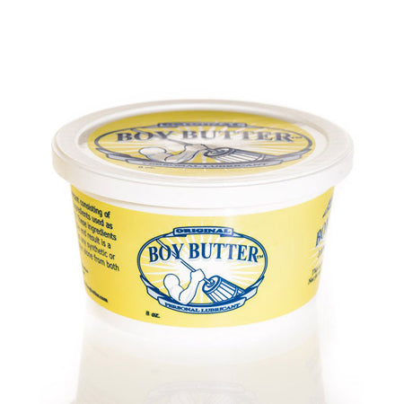 A container of Boy Butter personal lubricant with a yellow label on the lid.