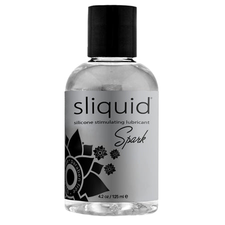 A bottle of Sliquid Spark Silicone Personal Lubricant, 4.2oz size, with a black cap and label featuring a floral design.